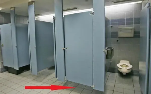 Why are public toilet doors always left open?