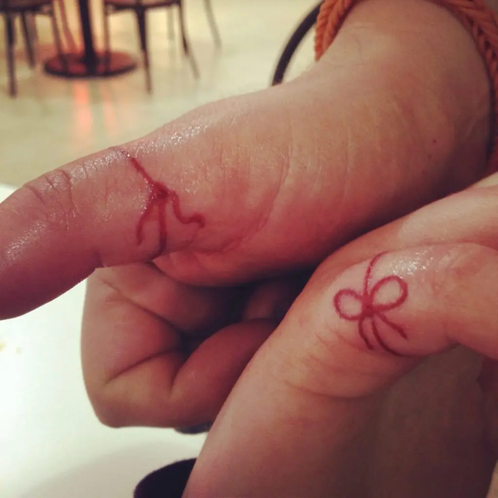 The Meaning Behind the Red String Tattoo