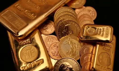 Gold firms on dip-buying; dimming Fed rate-cut hopes cap rise