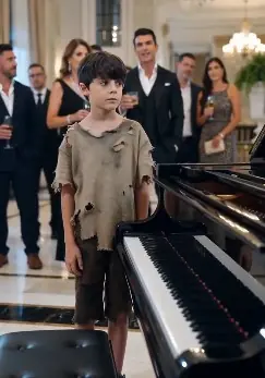 Part 2 : The grand hotel lobby glowed with luxury—crystal lights, soft piano, quiet laughter.