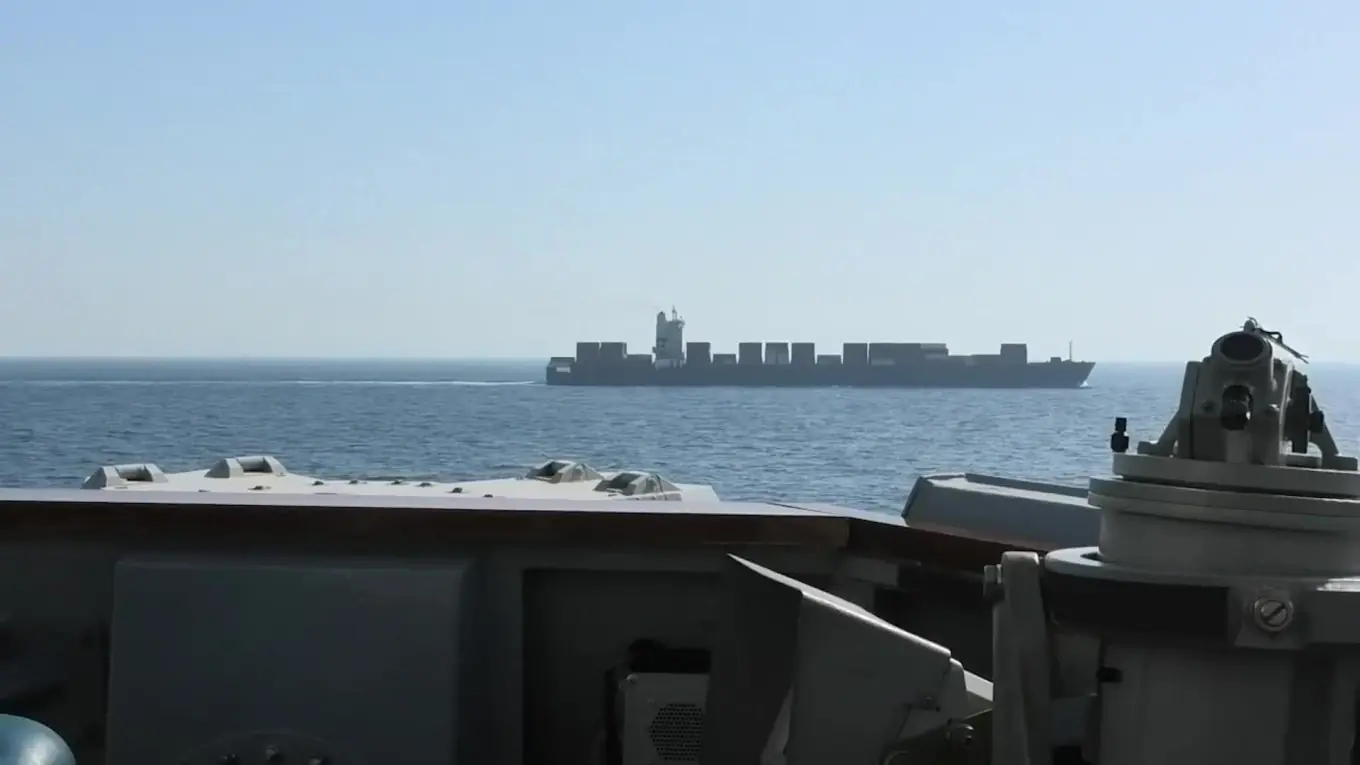 US warships fire artillery and seize Iranian cargo ships