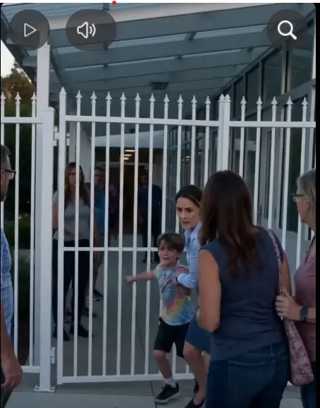 The mother slammed both hands against the locked classroom door so hard the glass beside it rattled.