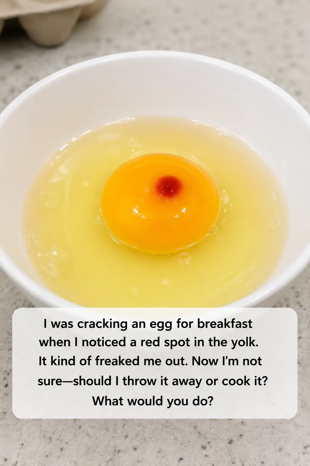 I just cracked an egg to make breakfast and saw this red spot in the yolk. It really grossed me out and now I'm wondering if I should toss the whole carton or just scoop it out and cook it anyway..