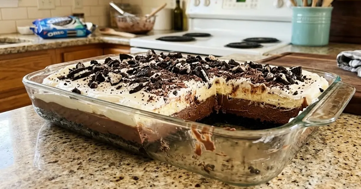 Ultimate Oreo Pudding Cake – Moist Chocolate Cake, Creamy Oreo Pudding & Cookies-and-Cream Topping